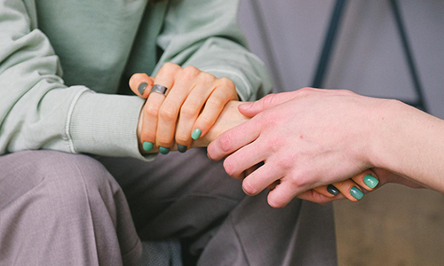 two people holding hands