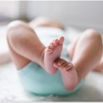 Infant lying on back