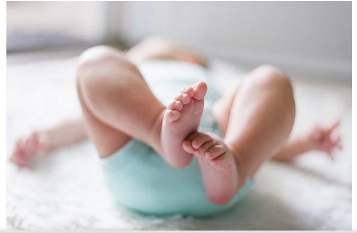 Infant lying on back