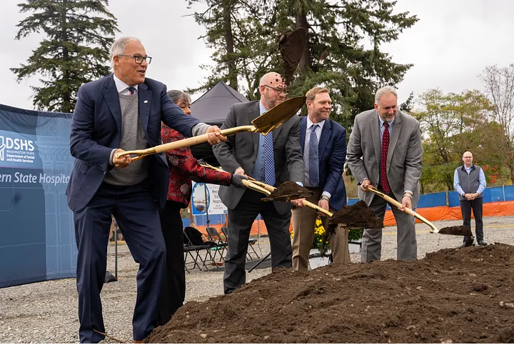 Gov. Jay Inslee and leaders from the state Department of Social and Health Services break ground on the new Forensic Center of Excellence on the Western State Hospital campus.