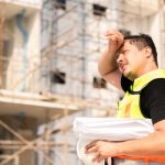 Construction worker standing outside building