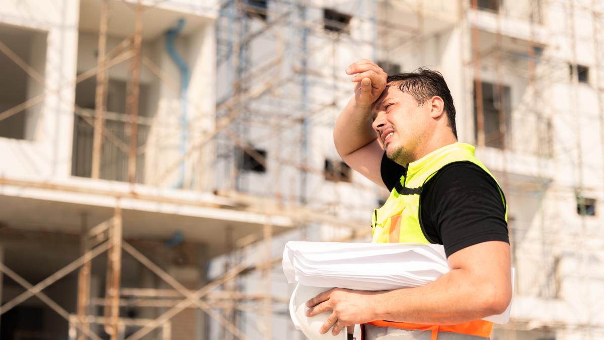 Construction worker standing outside building