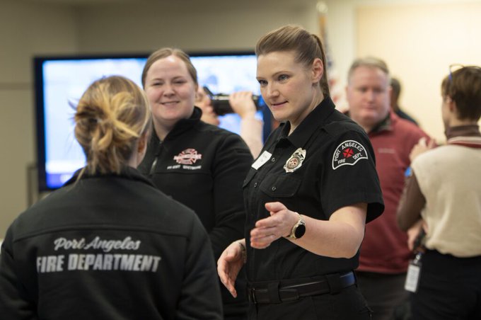 Three first responsders in a classroom