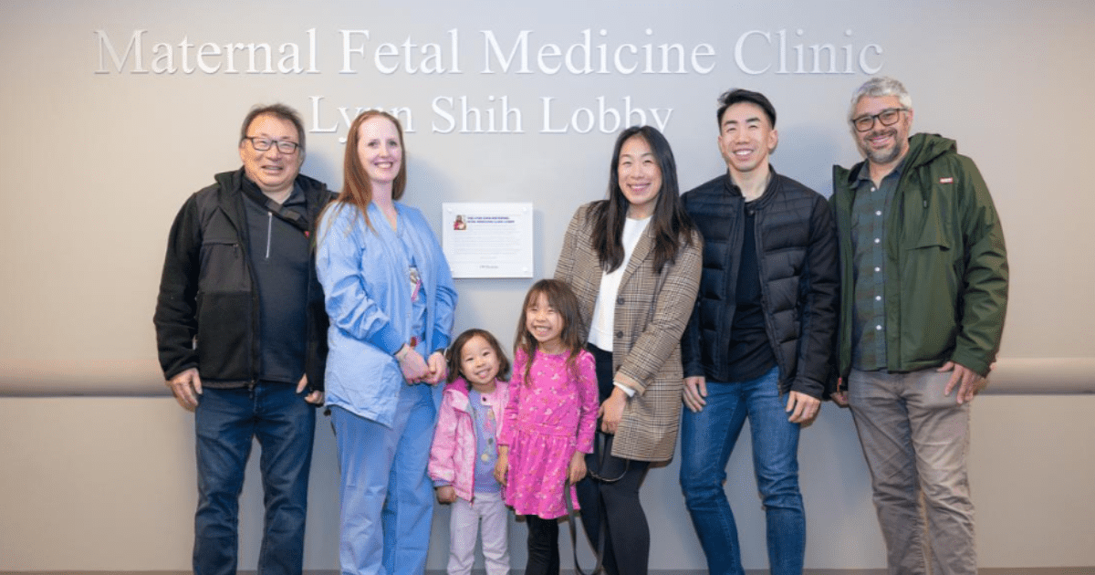 Group of people smiling in front of clinic