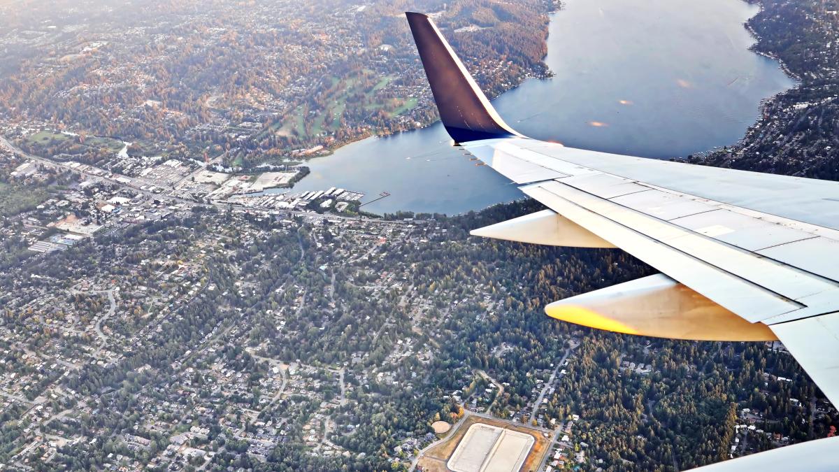 Tail of an airplane flying over Seattle