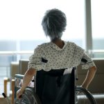 Woman in facility in wheelchair