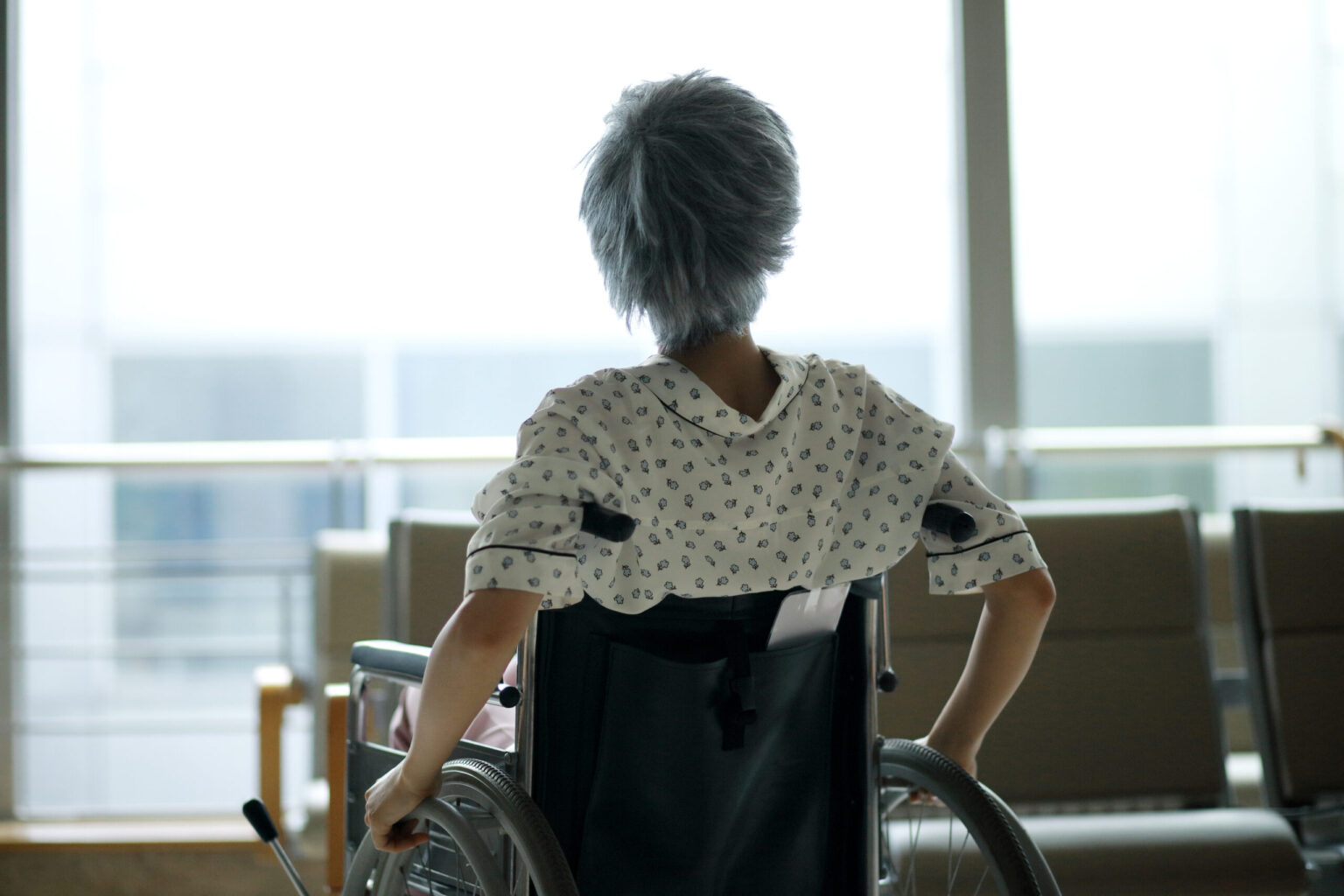 Woman in facility in wheelchair